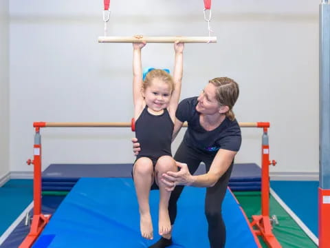 a person and a child on a bar