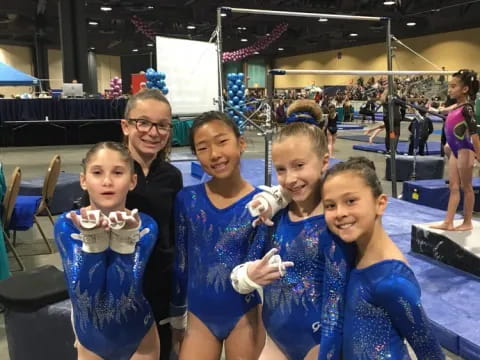 a group of girls in blue uniforms
