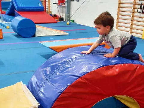 a boy playing on a trampoline