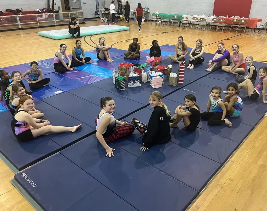 a group of people sitting on mats