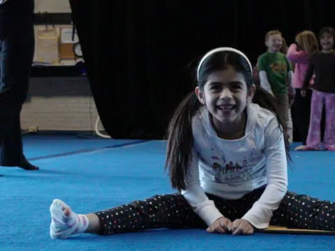 a girl sitting on the floor