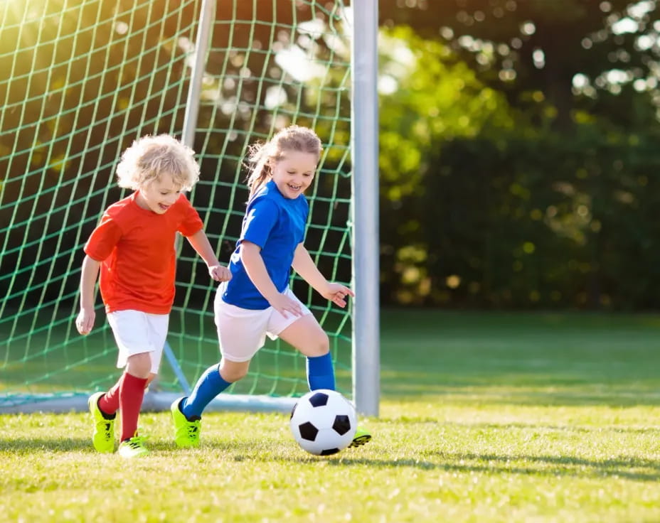 kids playing football on a field