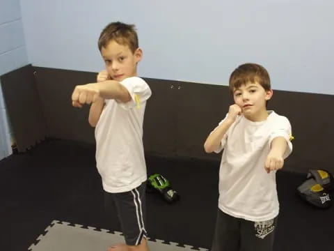 two boys in white shirts