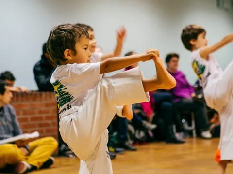 a young boy in a karate uniform