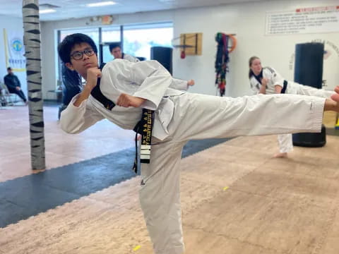 a man in a karate uniform