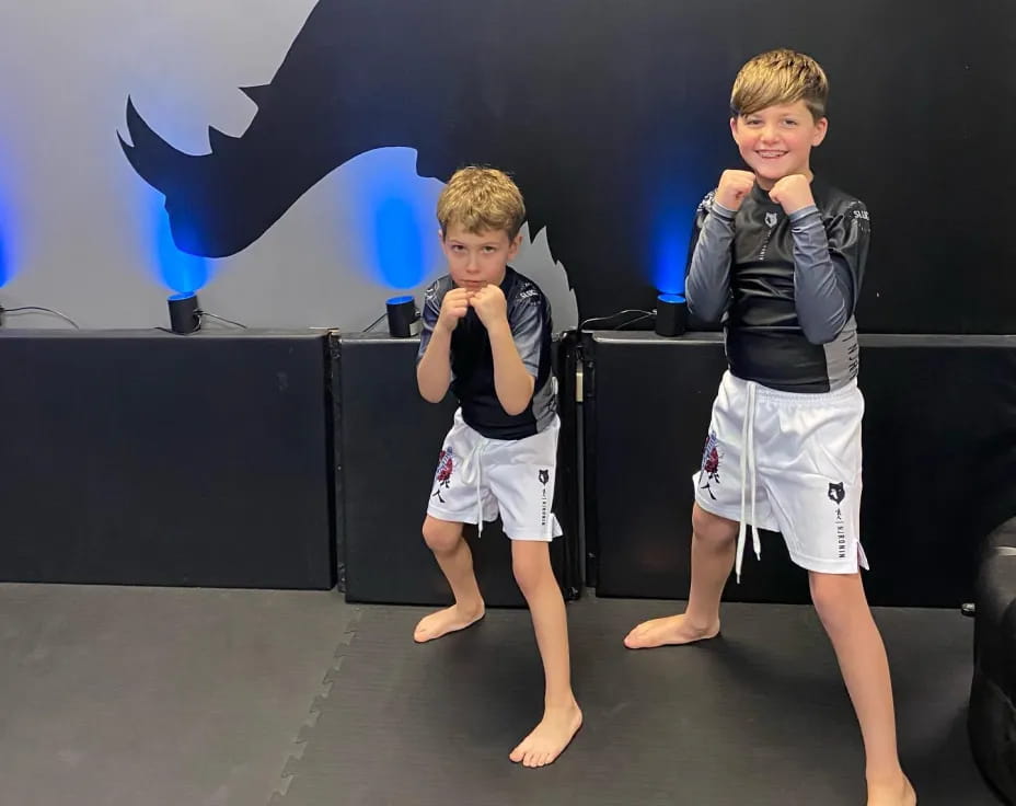 two boys standing on a stage