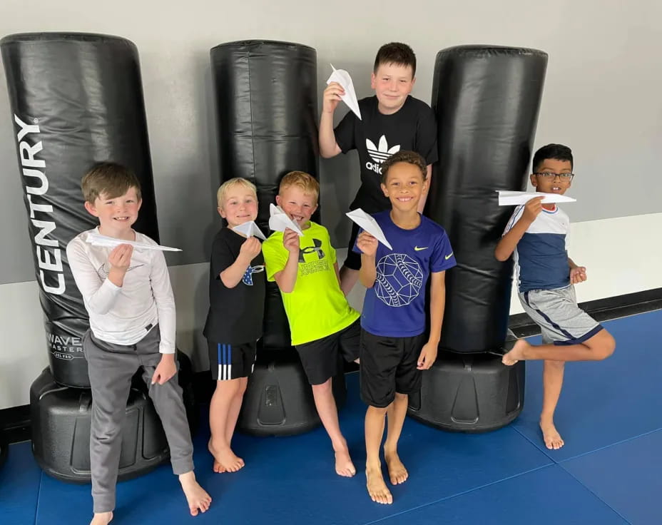 a group of kids posing for a photo