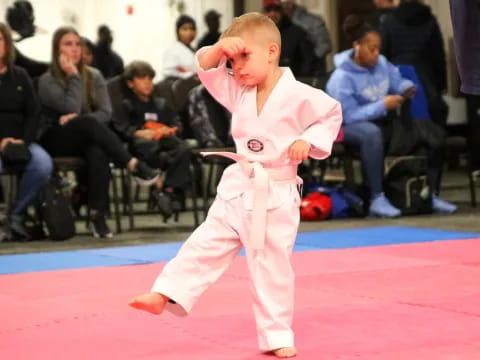 a boy in a karate uniform