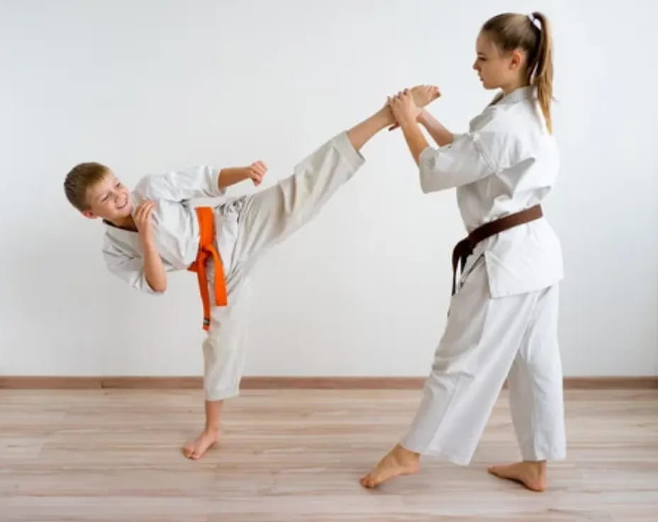 a man and a woman practicing karate