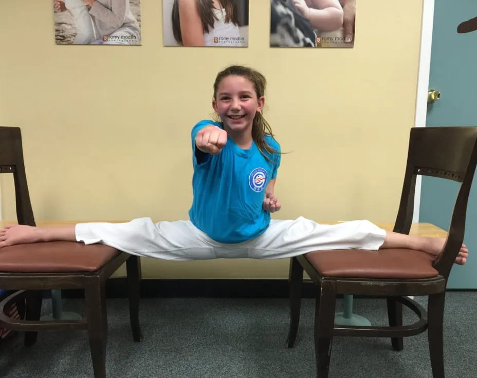 a girl sitting on a chair