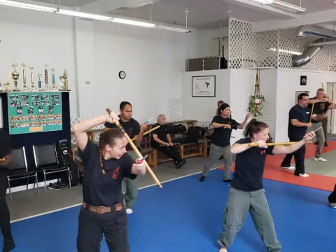 a group of people holding swords