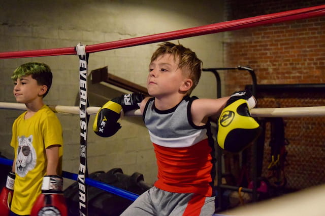 a boy in a boxing ring