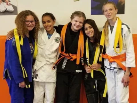 a group of people wearing medals