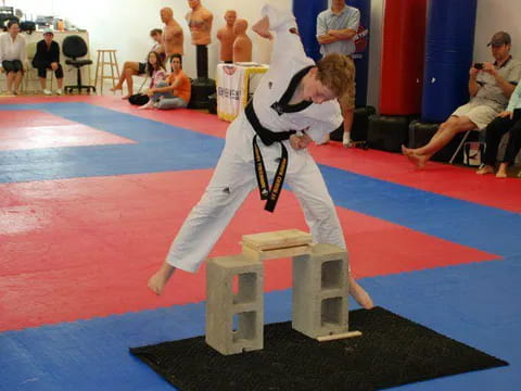 a boy in a karate uniform