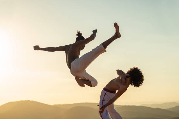 a man and a woman jumping in the air