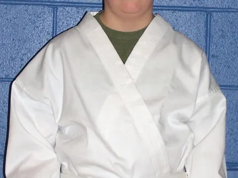 a boy wearing a white shirt