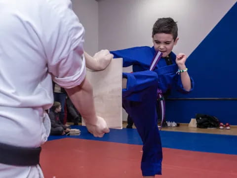 a boy in a karate uniform