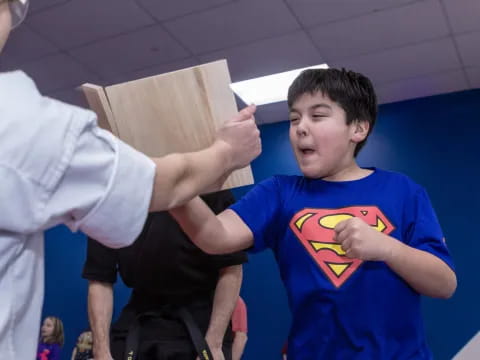 a person holding a wooden board