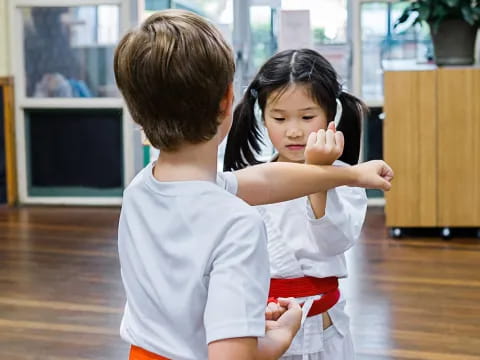 a boy and girl holding each other