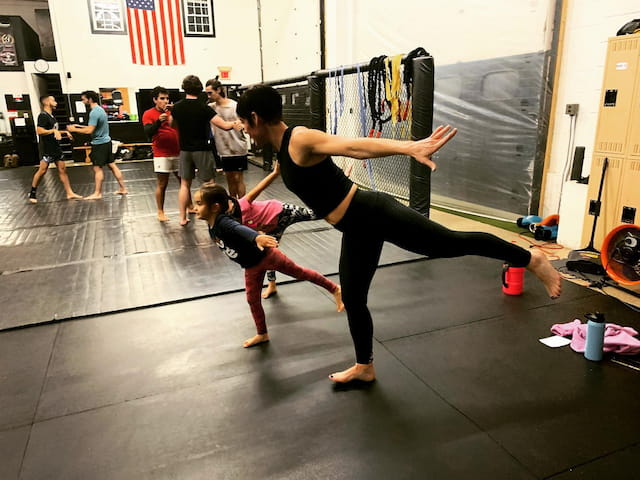 a man and a woman doing yoga