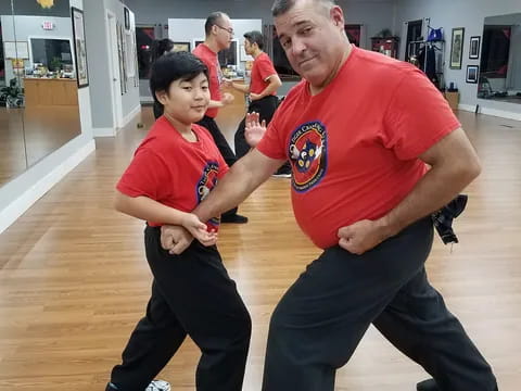 a man and a boy dancing