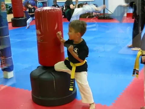 a boy playing with a toy