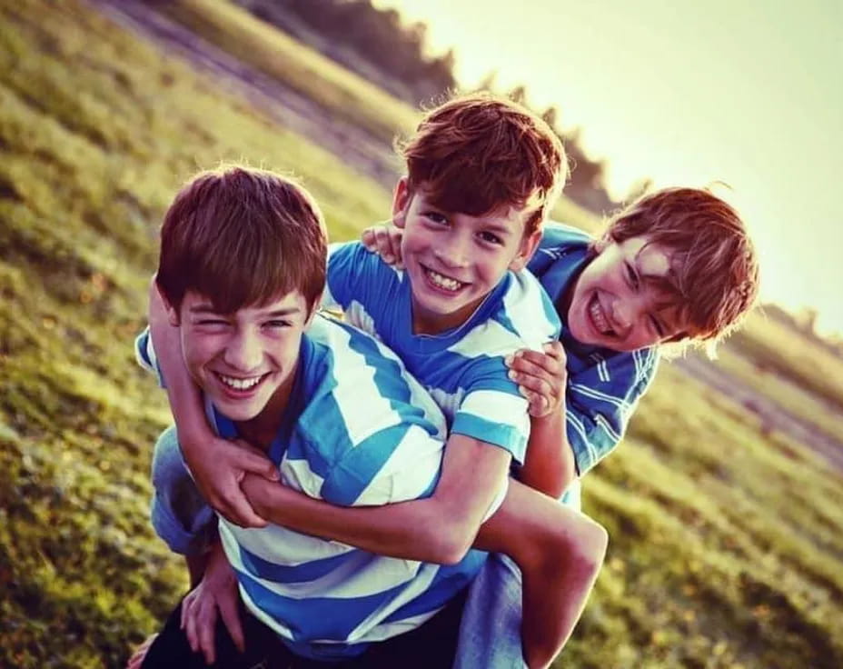 a group of boys hugging