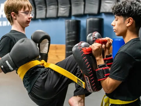 a couple of men boxing