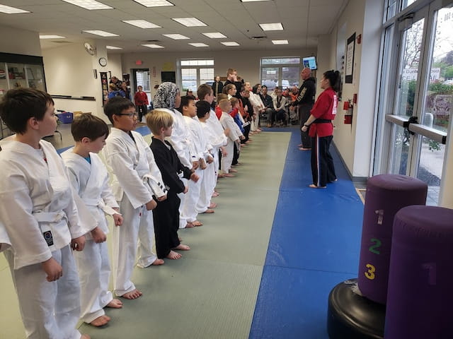 a group of people in white lab coats in a room