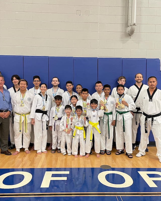 a group of people in karate uniforms