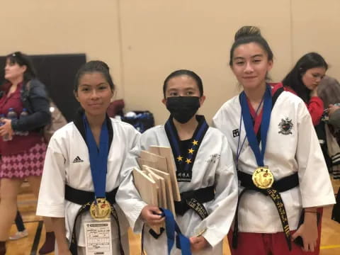 a group of women wearing medals