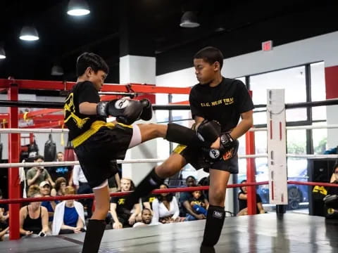 a couple of men in a boxing ring