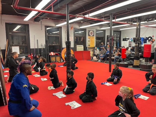 a group of people sitting on the floor