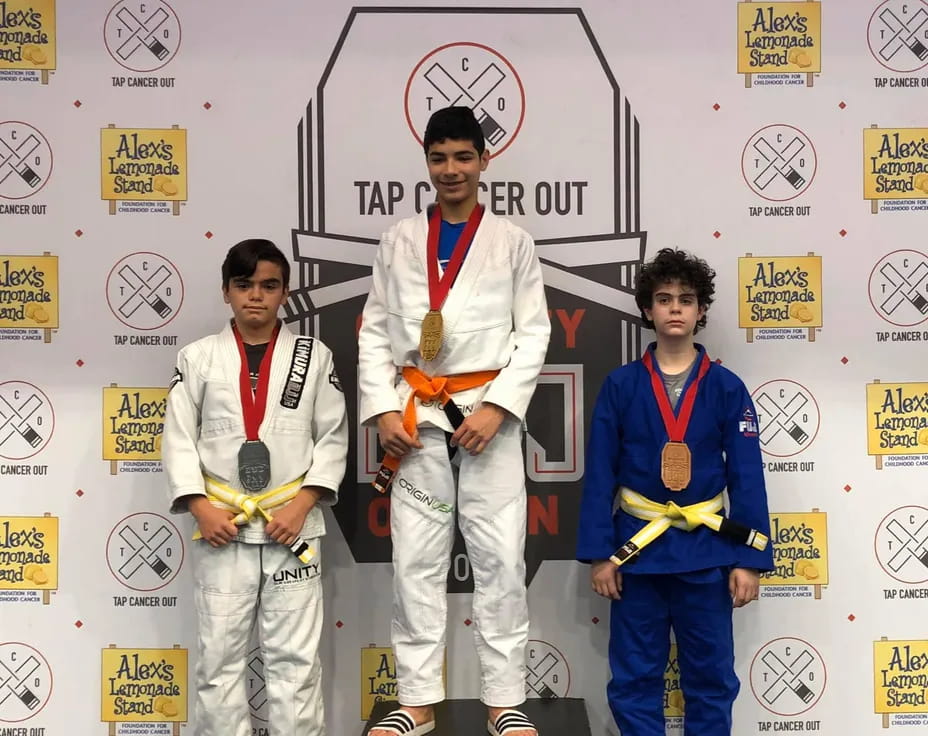 a group of boys wearing medals