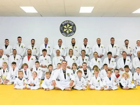 a group of people in white robes