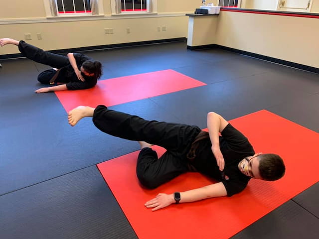 a couple of people doing yoga