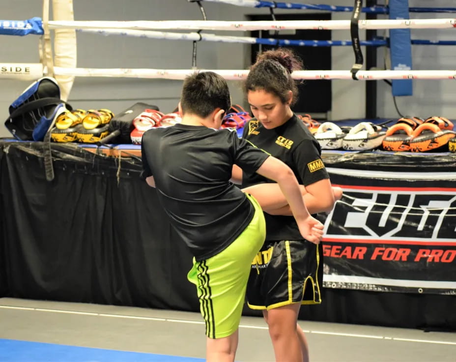 two boys in a wrestling ring