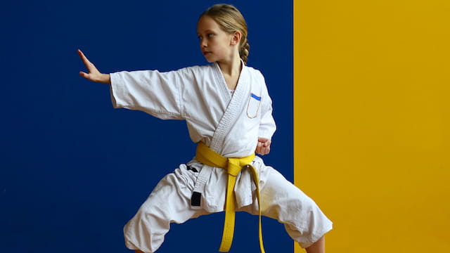 a man in a karate uniform