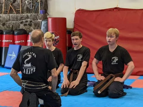 a group of men in black shirts