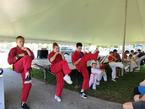 a group of people in red uniforms