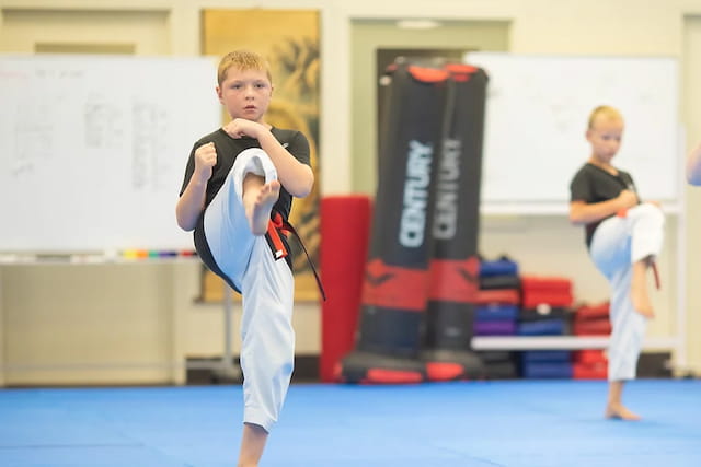 a boy in a karate uniform