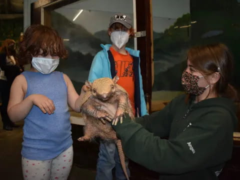 a woman holding a stuffed animal