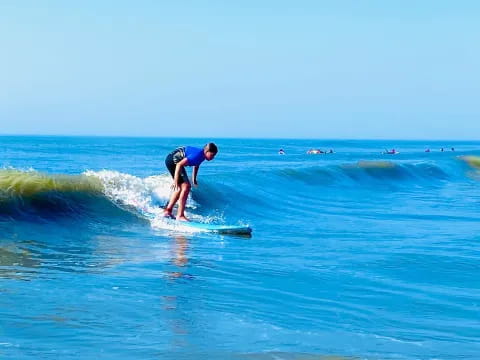 a person surfing on the waves
