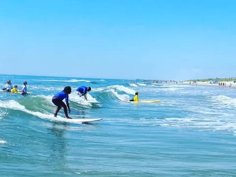 surfers riding waves in ocean