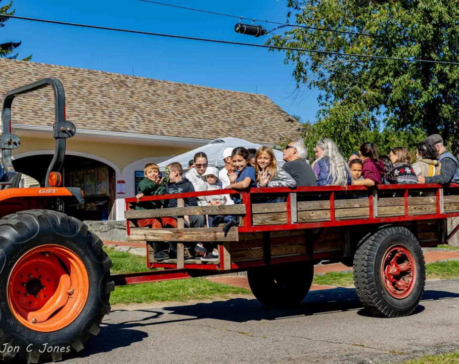 a group of people on a tractor