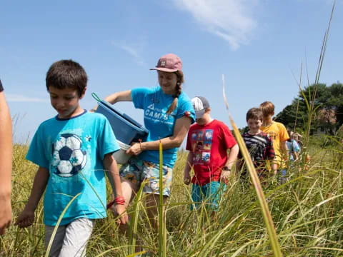 a group of kids in a field
