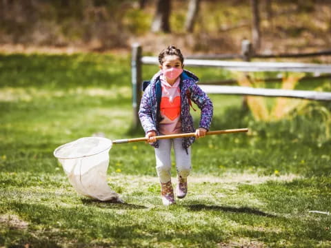 a girl holding a bucket