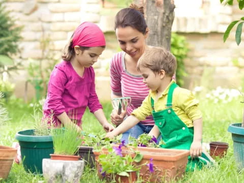 a group of children in a garden