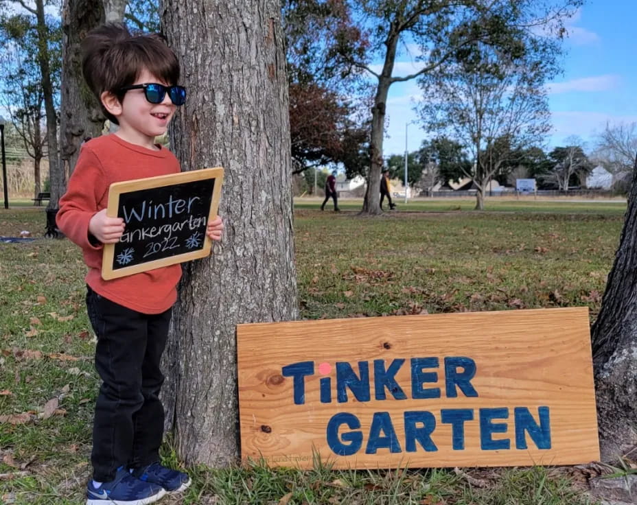 a boy holding a sign