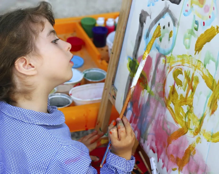 a young girl painting